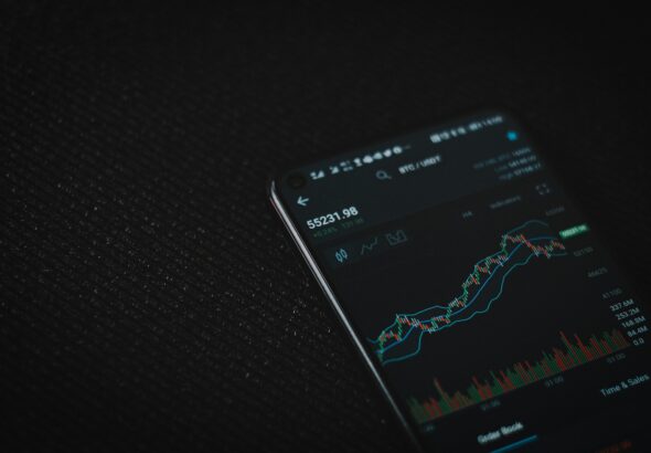 black android smartphone on black textile