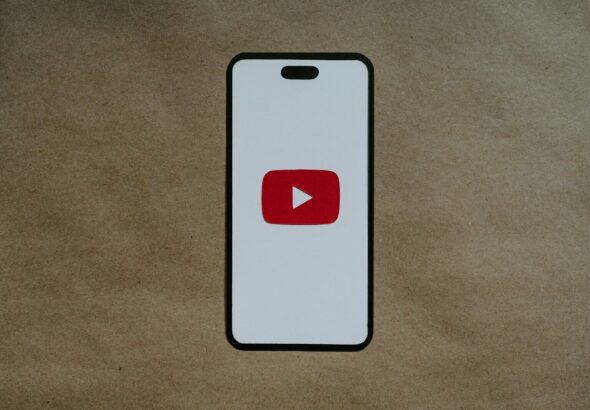 a white phone with a red youtube logo on it